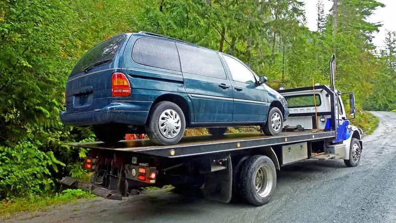 Burnaby flatbed towing a cargo van